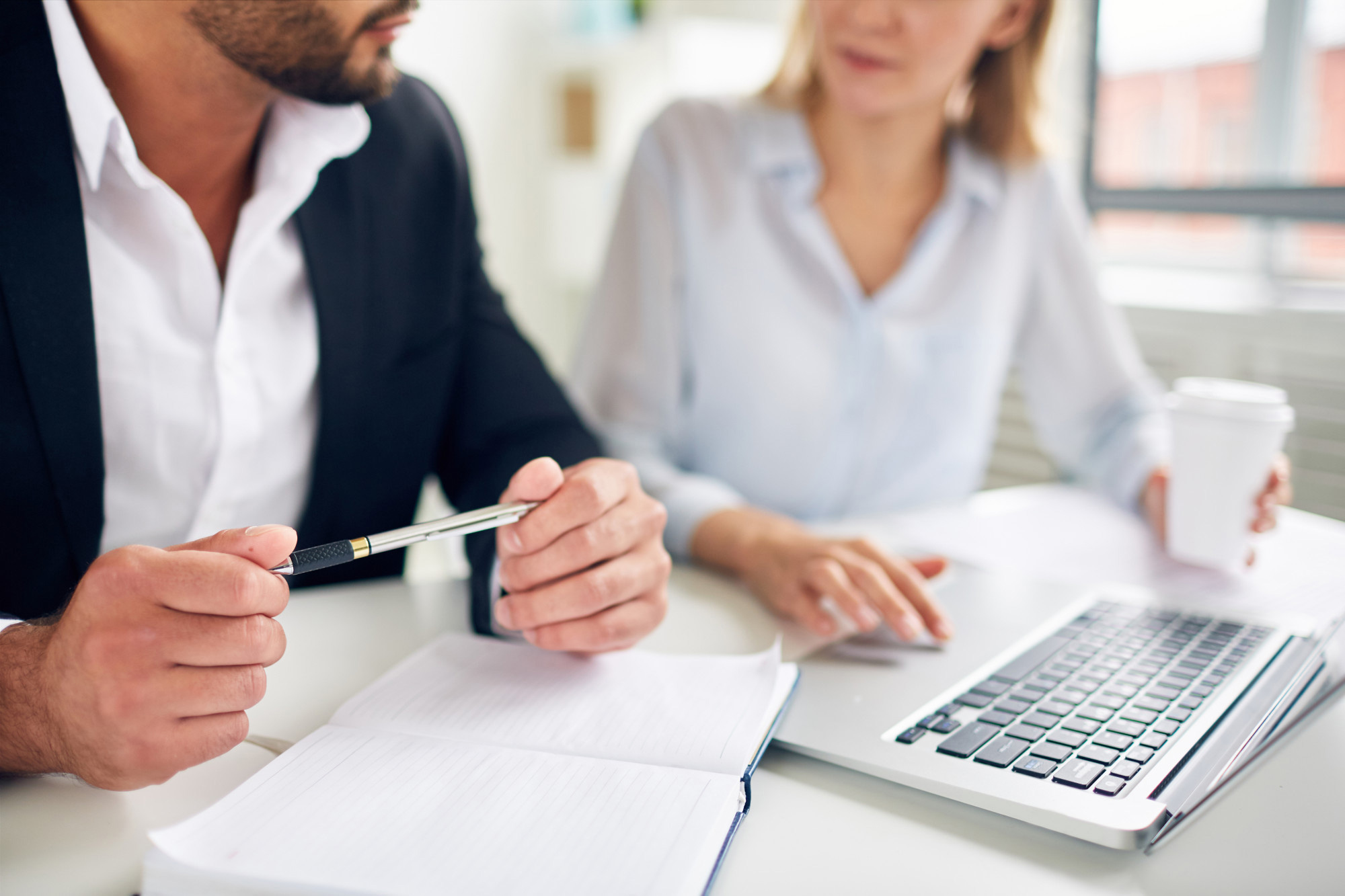 Two people sitting at computer